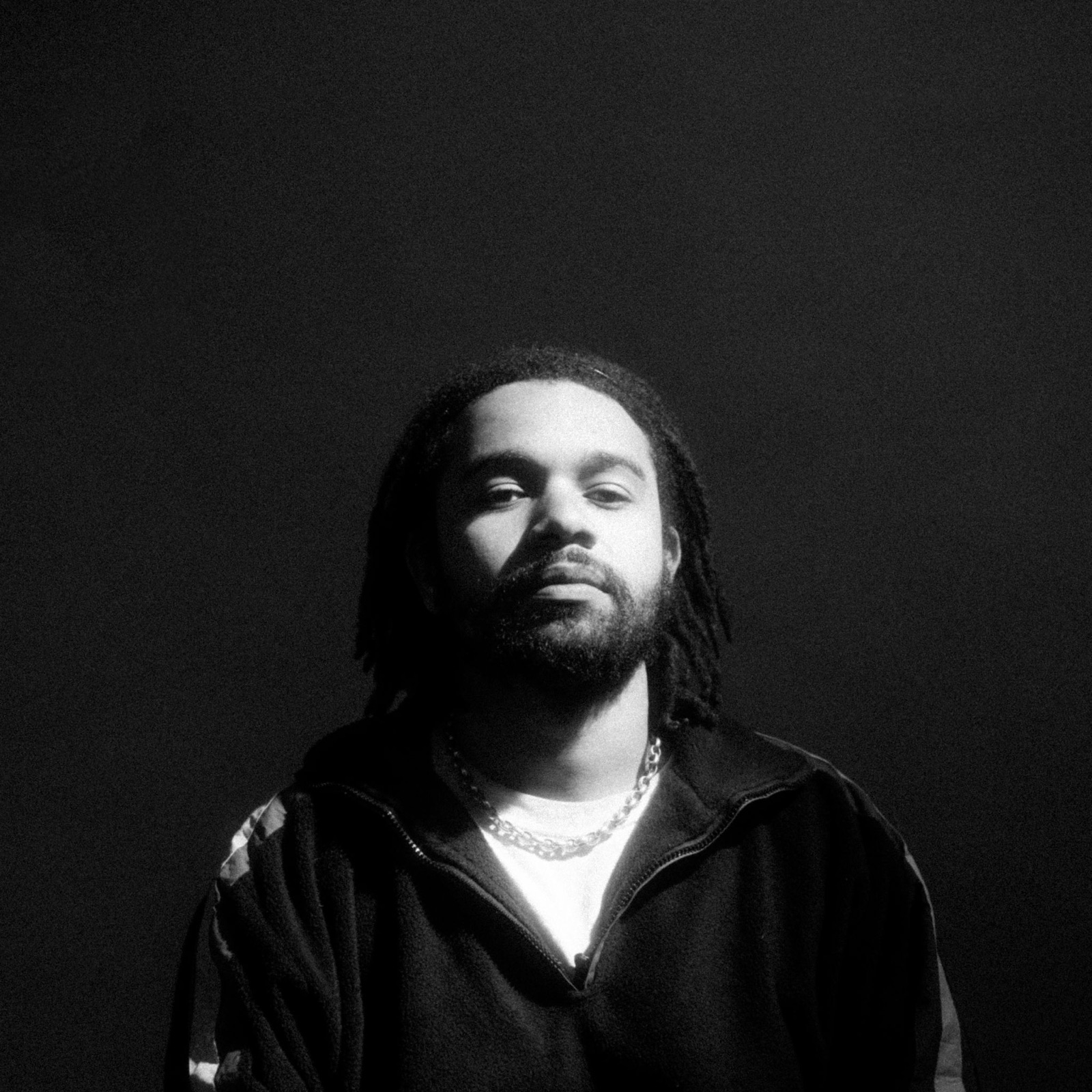 Yorke, black and white portrait, single light against a dark background